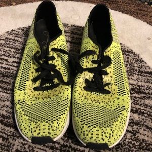 Neon yellow tennis shoes